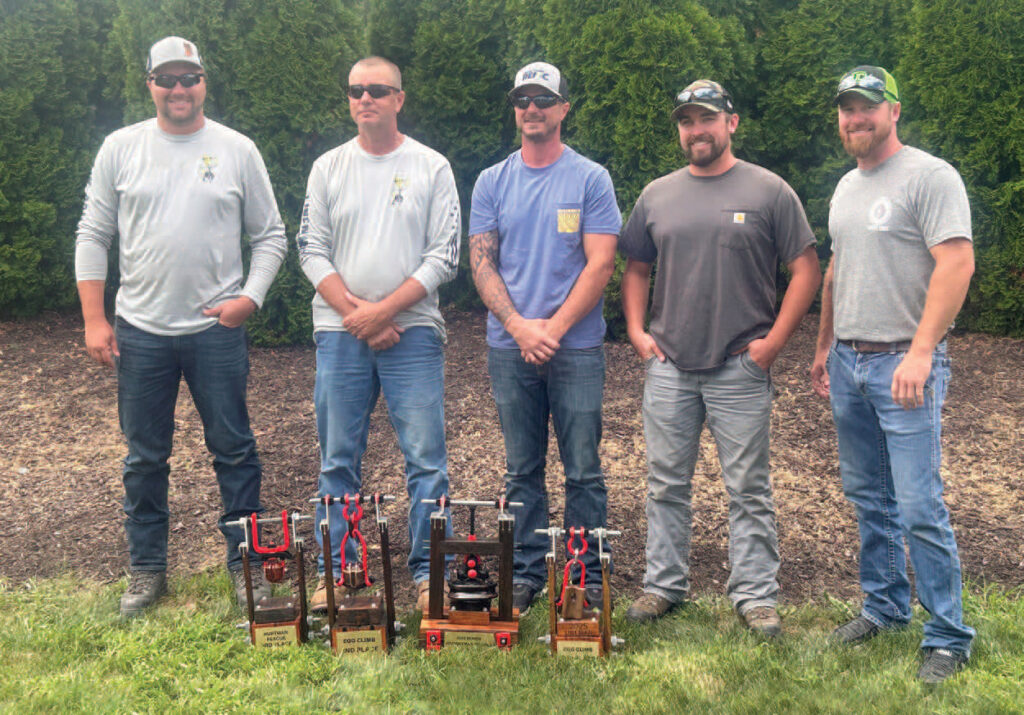 Left to right: Michael
Witvoet, Craig Smart,
Brett Wilhite, Jake
Steinke, and Matt
Beasley with Smart
and Wilhite’s awards.