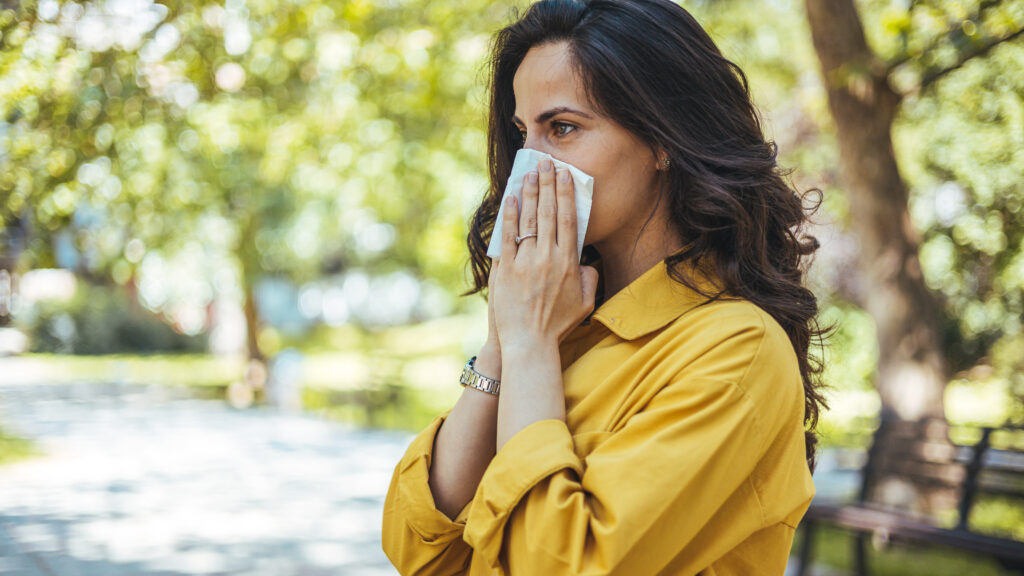 Woman with facial kleenex