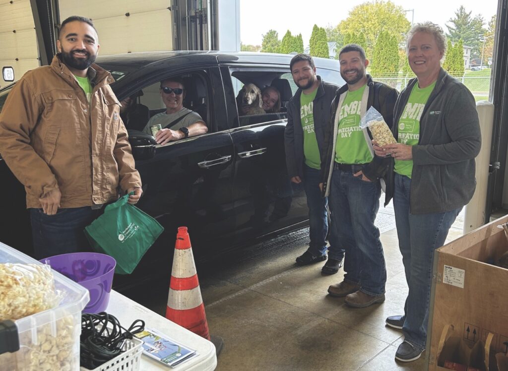 BCREMC board members and employees greet members, as well as some furry friends.