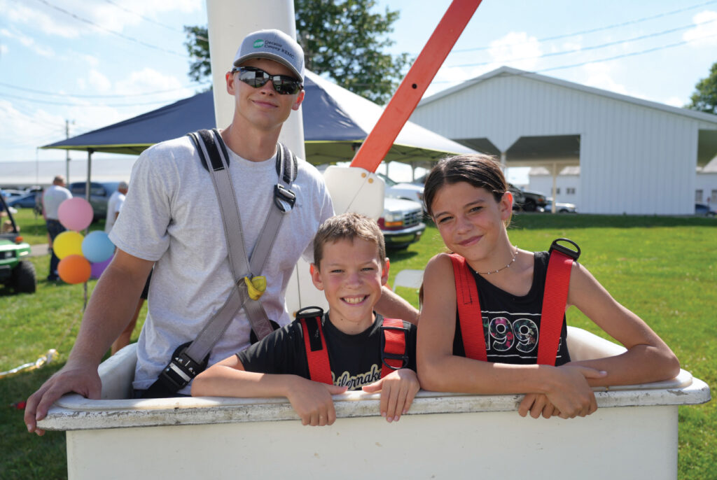 Kids taking a bucket truck ride