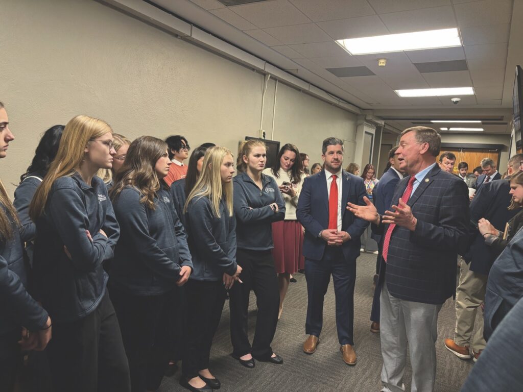 Rep. Kendell Culp speaks with the Kankakee Valley REMC Junior Board of Directors before making his way to a committee hearing.