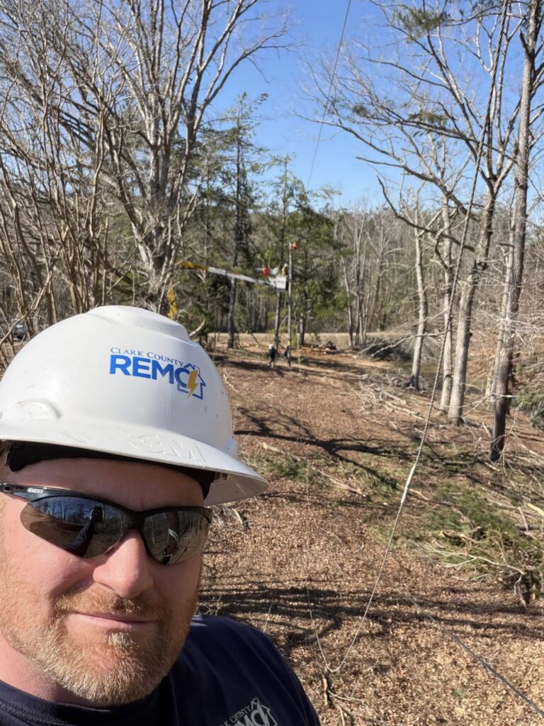 Bo Simpson of Clark County REMC helps clear damage in Mississippi after Winter Storm Fern.