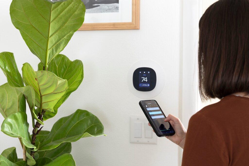 Woman with smartthermostat