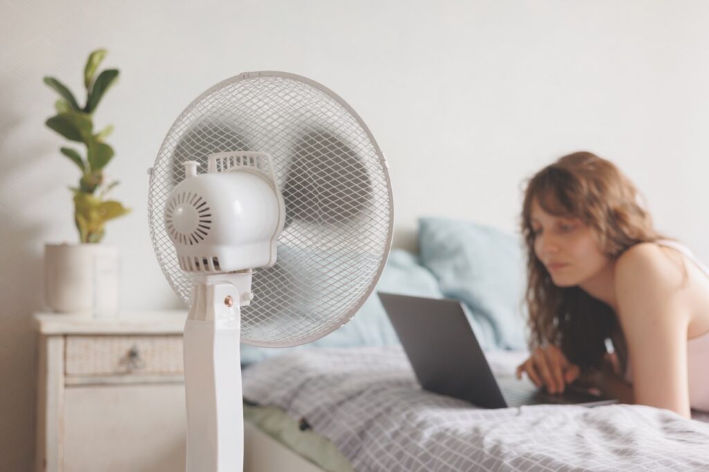 Woman in front of a fan