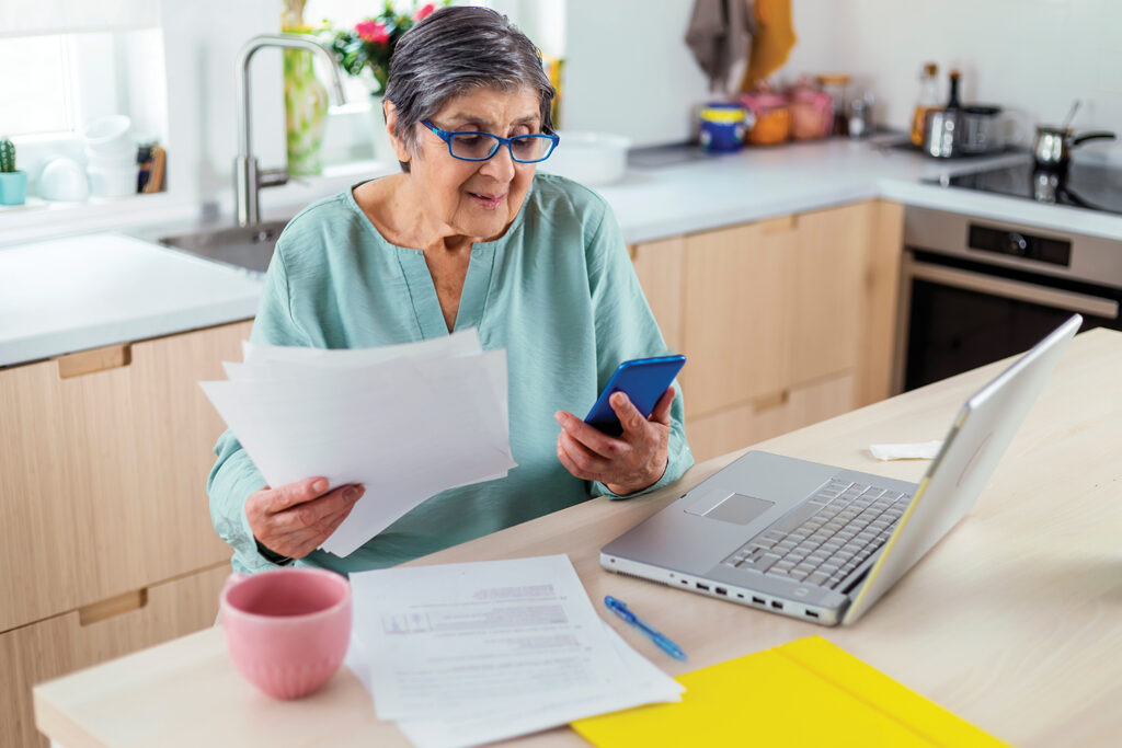 Older lady paying bills