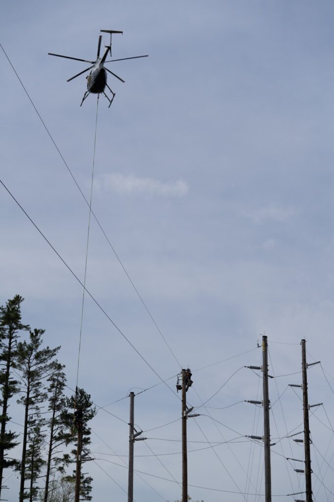 Helicopter above power lines