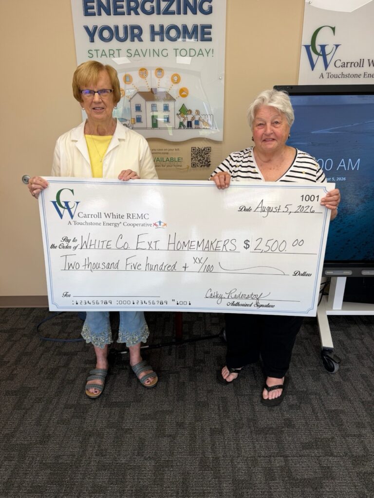 Liz Rice, left, and Margaret Foutch accepting the $2,500 check on behalf of the White County Extension Homemakers.