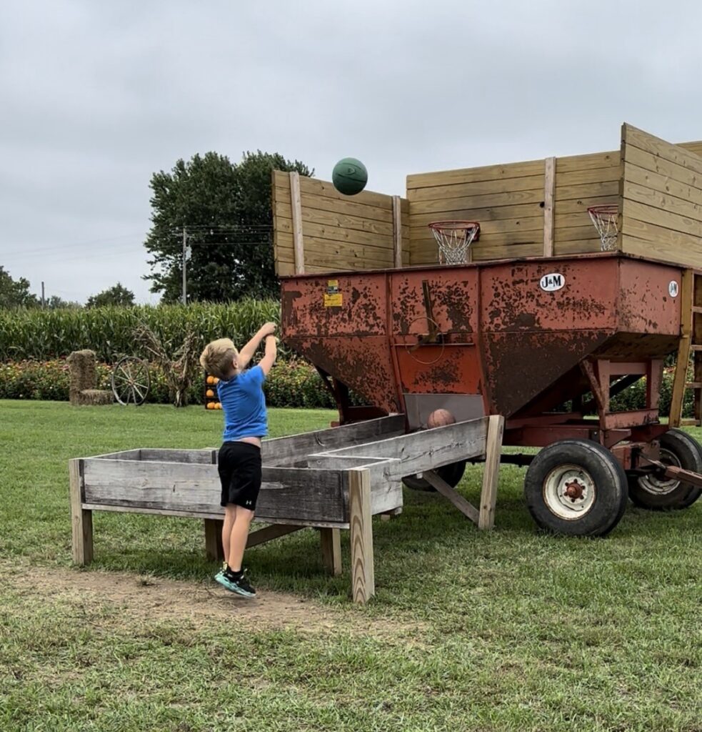 Kid at pumpkin patch
