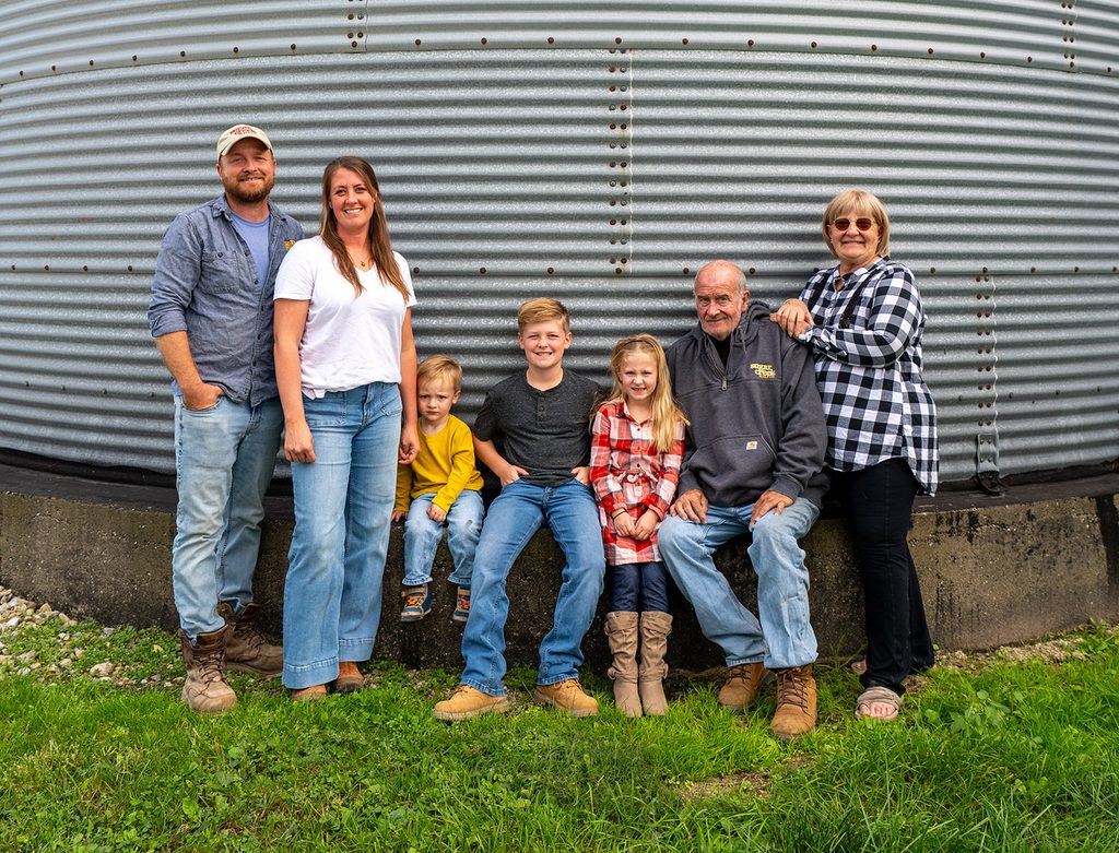 Caleb Michalke, far left, poses with his wife, Whitney, his children, Jack, Arlen, and Maris, and his parents, Jim and Heather.