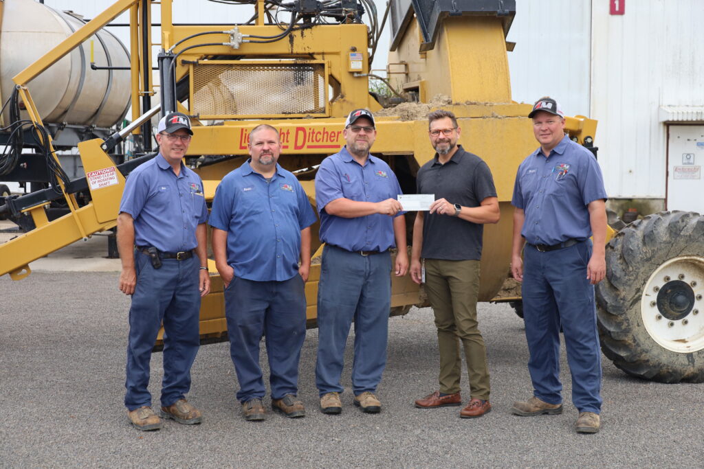 Economic Development and Key Accounts Coordinator Peter Niagu recently presented the rebate check to the Liebrecht Manufacturing team.